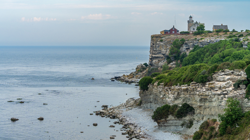 Sea coast view with lighthouse on the rock. Stora Karlso, Gotland, Sweden.